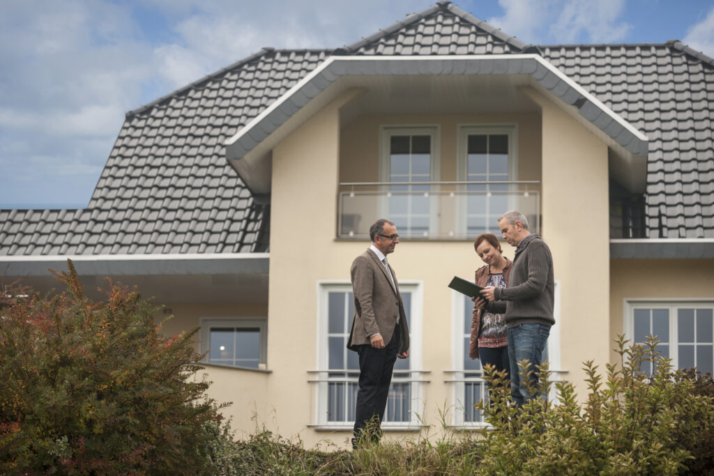 Real Estate agent assisting potential buyers